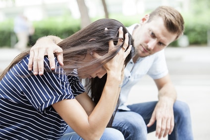 Man comforting his sad mourning friend